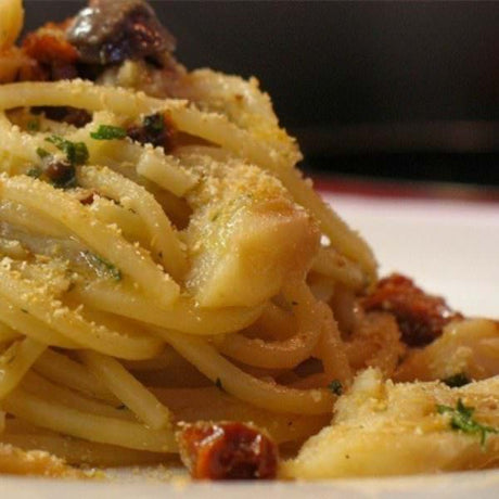 Spaghetti With Cod Fish, Olives, Capers And Tomatoes